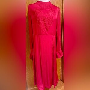 Silk pink dress with a slit up to the waist line